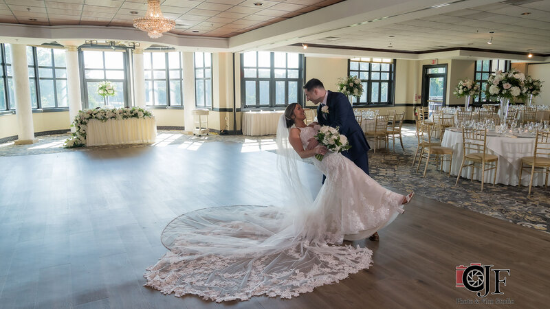 Bride and groom dancing in private event room