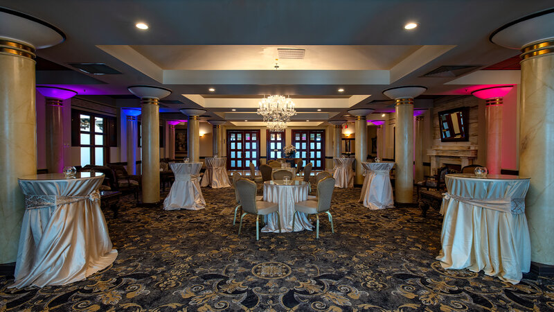 Private reception room with multicolored lights and tables