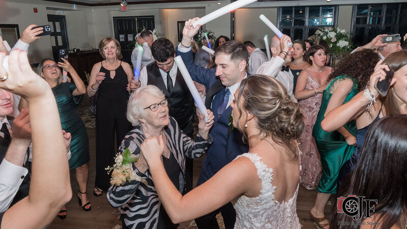 Bride and guests dancing