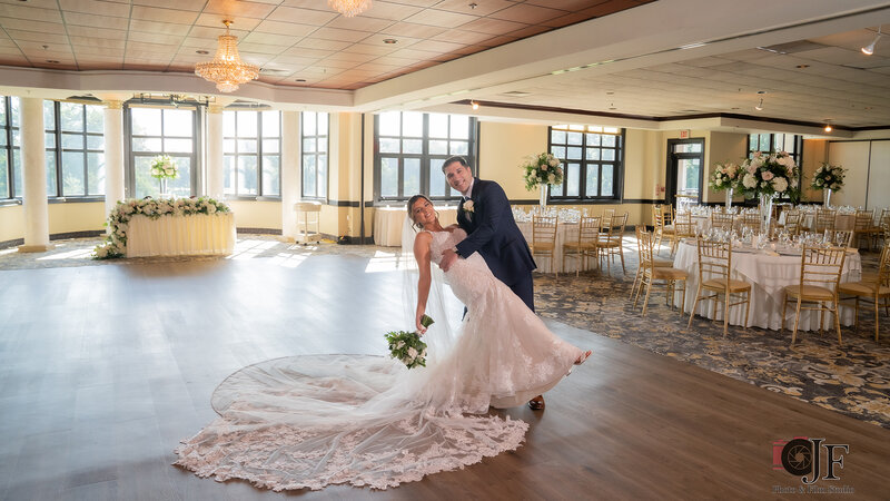 Bride and groom dancing and smiling