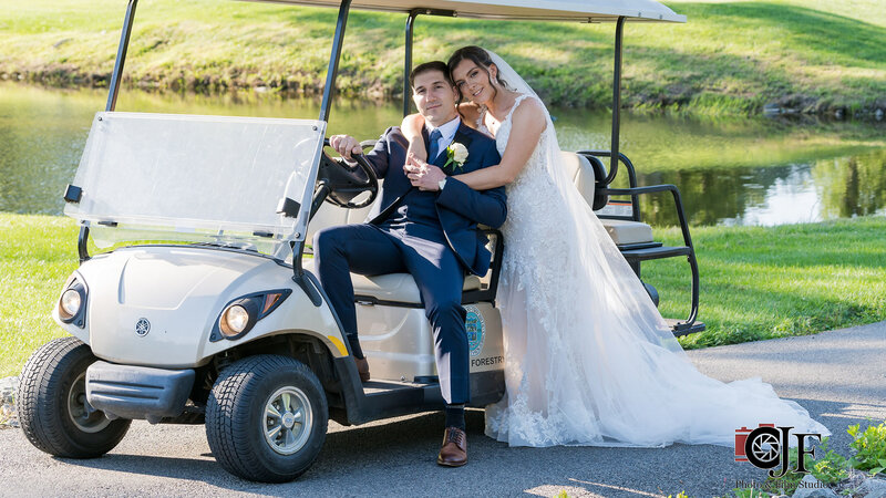 Bride and groom in golf cart