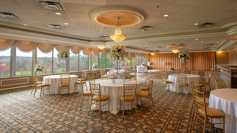 Many set tables with flower arrangements