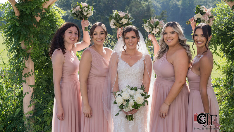 Bride and bridesmaids outside