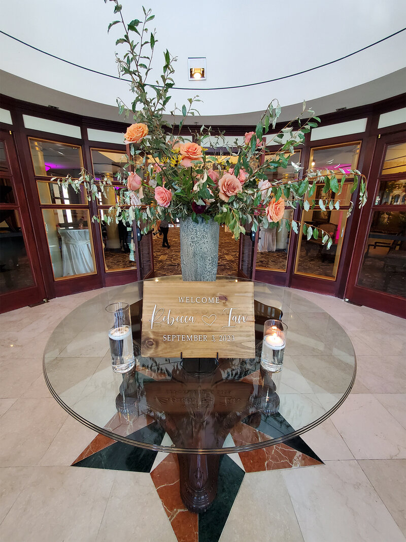 Flower arrangement on podium with placard