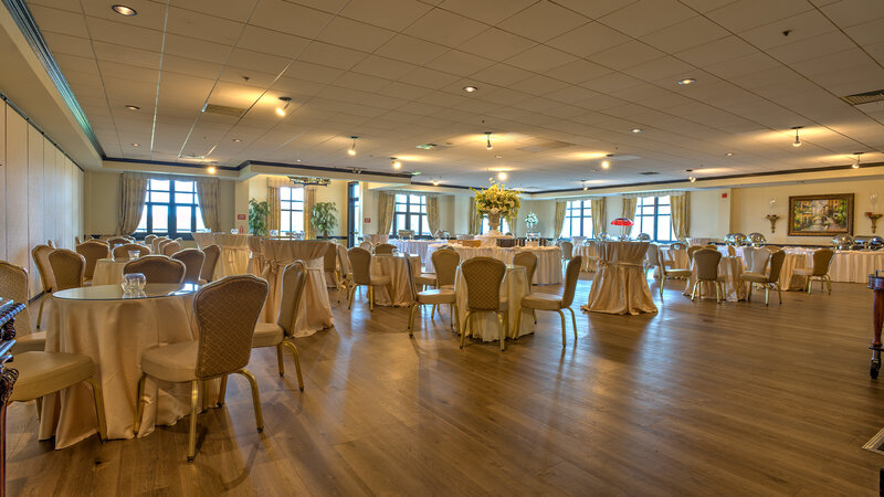 Many set tables in private event room